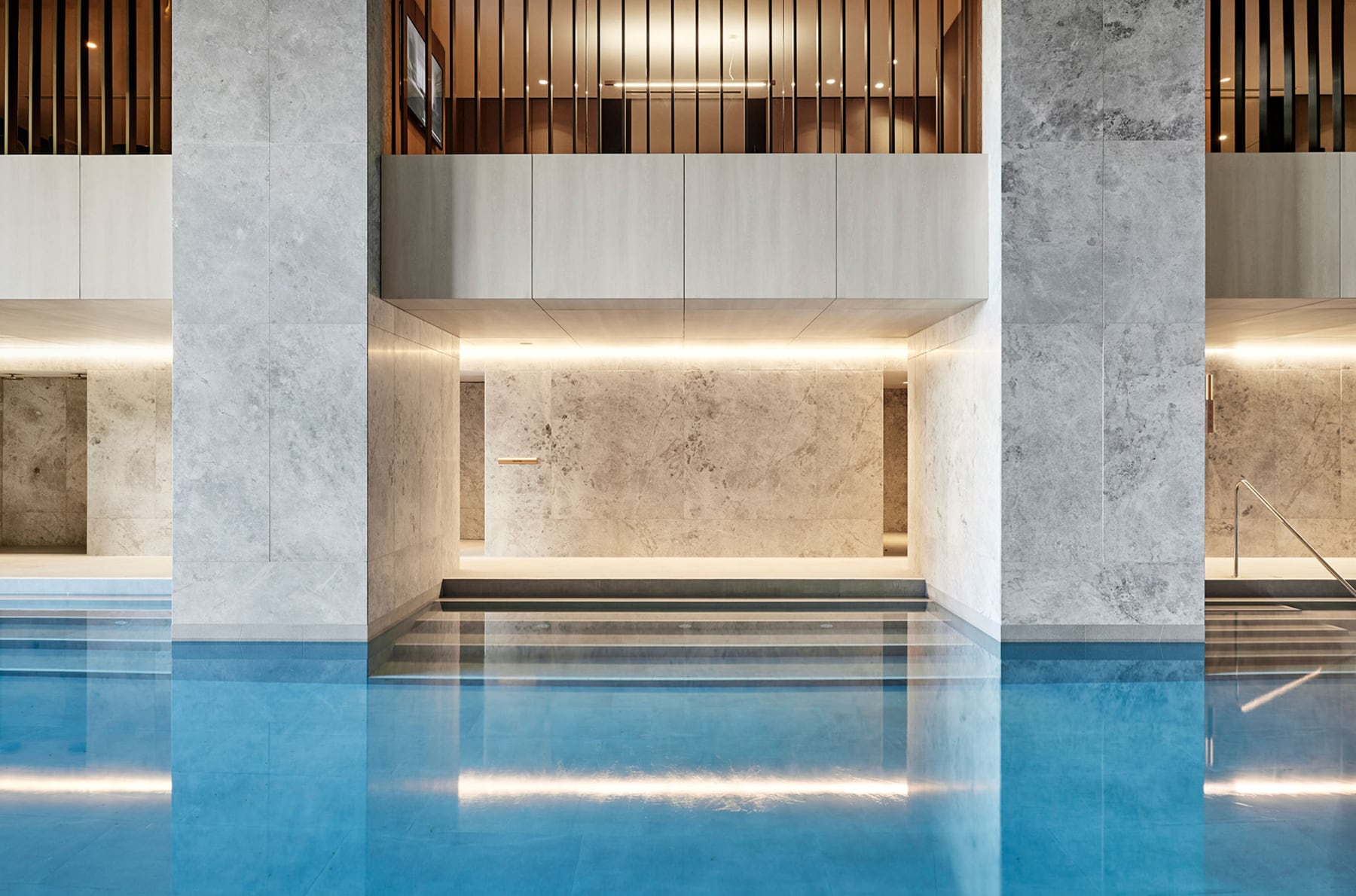 A pool with a steam room and sauna